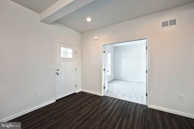 entryway with baseboards, beam ceiling, visible vents, and dark wood-style flooring