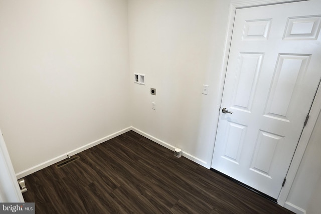 washroom featuring washer hookup, dark wood-type flooring, electric dryer hookup, laundry area, and baseboards