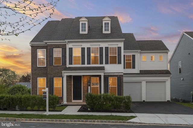 view of front of property featuring a garage