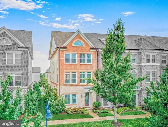 20765 Duxbury Ter, Ashburn, VA 20147 - view of front of property with brick siding and a front lawn