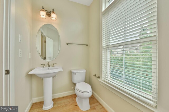 20765 Duxbury Ter, Ashburn, VA 20147 - half bath featuring toilet and wood finished floors