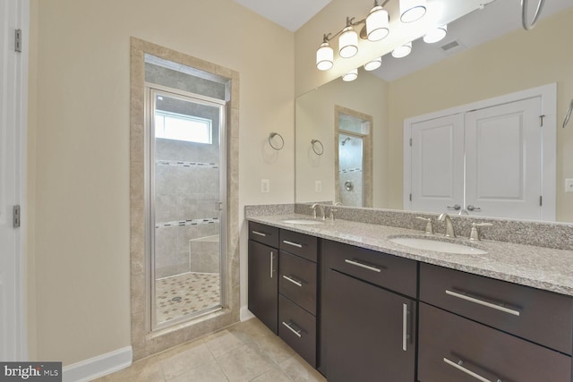 20765 Duxbury Ter, Ashburn, VA 20147 - full bath featuring a shower stall, double vanity, and tile patterned floors