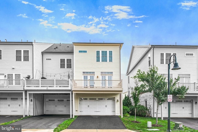 20765 Duxbury Ter, Ashburn, VA 20147 - back of property with a garage and driveway