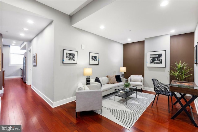 living room with dark hardwood / wood-style flooring