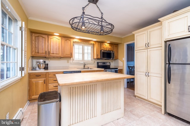 kitchen with stainless steel appliances, a sink, wood counters, ornamental molding, and baseboard heating