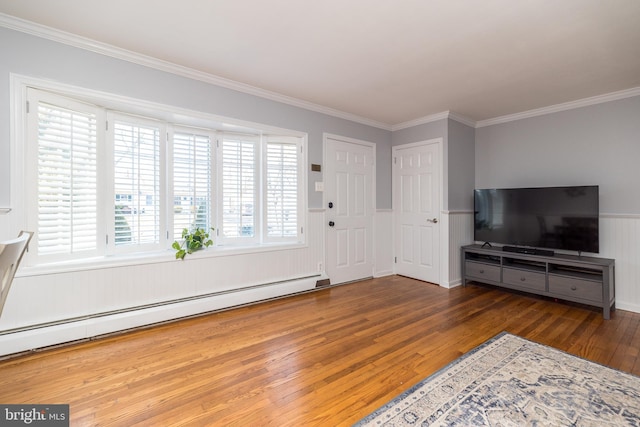 living area with a wainscoted wall, ornamental molding, a baseboard radiator, and dark wood finished floors