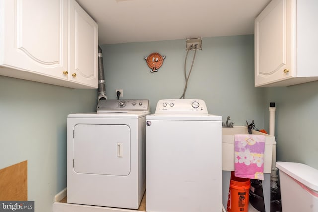 laundry room featuring washer and dryer and cabinet space