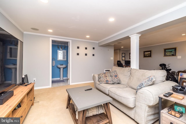 living area featuring ornamental molding, recessed lighting, light colored carpet, and ornate columns