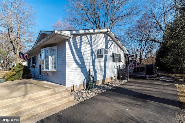 view of property exterior featuring driveway