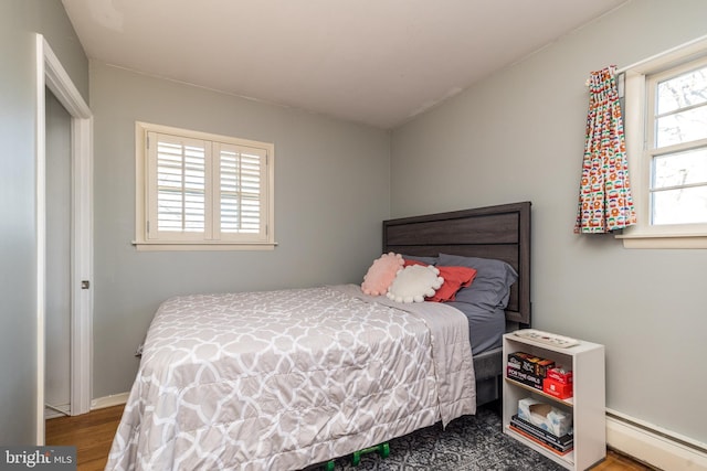 bedroom with baseboards and baseboard heating