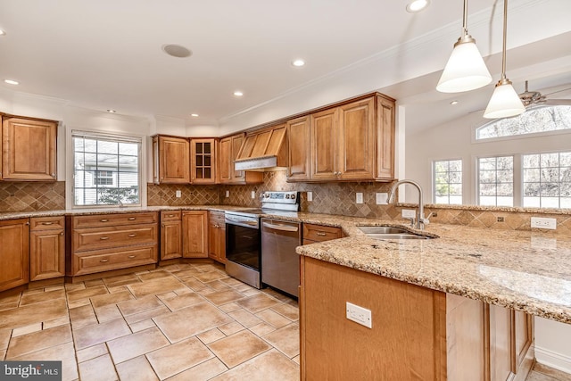 kitchen with pendant lighting, stainless steel appliances, kitchen peninsula, and sink