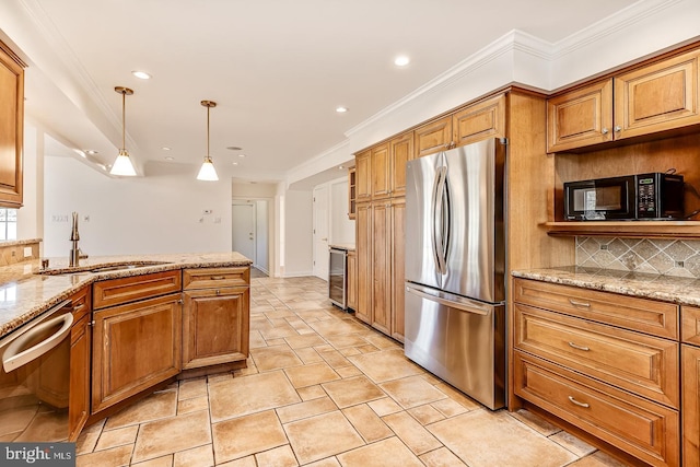 kitchen with appliances with stainless steel finishes, sink, beverage cooler, hanging light fixtures, and light stone countertops