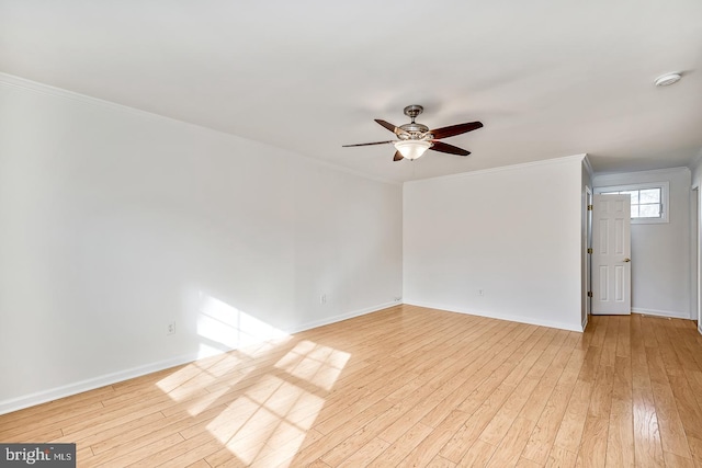 empty room featuring ornamental molding, ceiling fan, and light hardwood / wood-style flooring