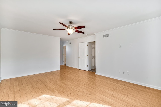 spare room with crown molding, light hardwood / wood-style flooring, and ceiling fan