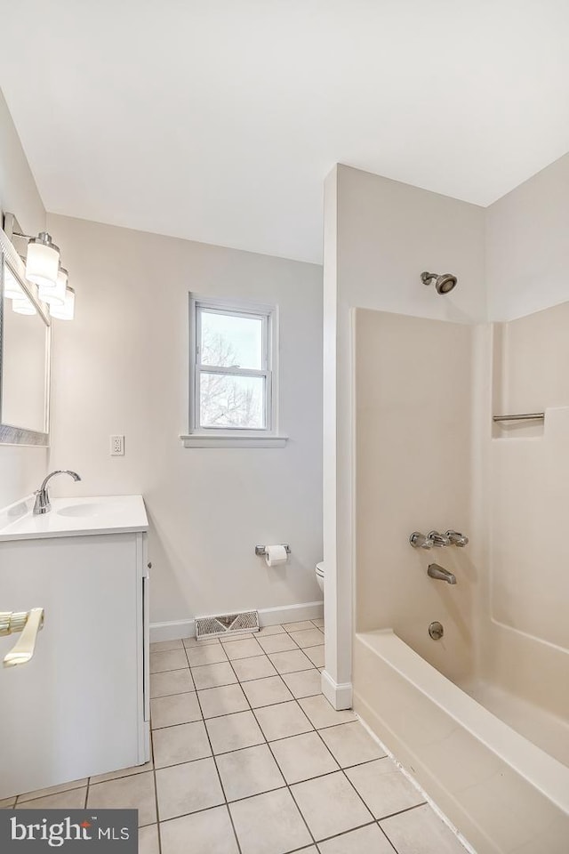 full bathroom with shower / washtub combination, toilet, tile patterned flooring, and vanity