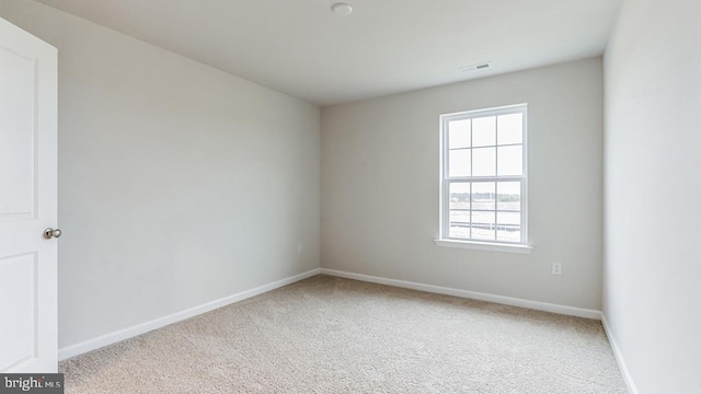 unfurnished room with carpet floors