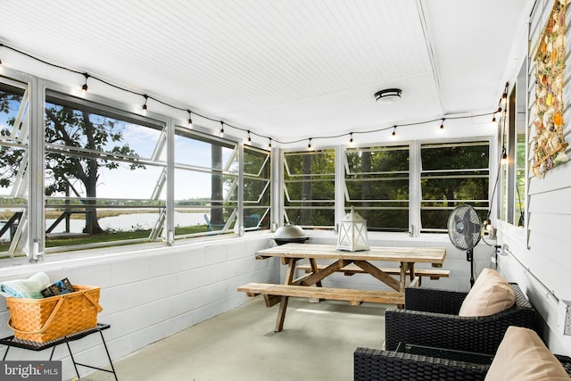 sunroom with a water view