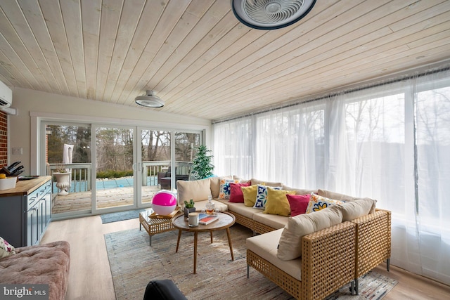 sunroom / solarium featuring wooden ceiling and a wealth of natural light