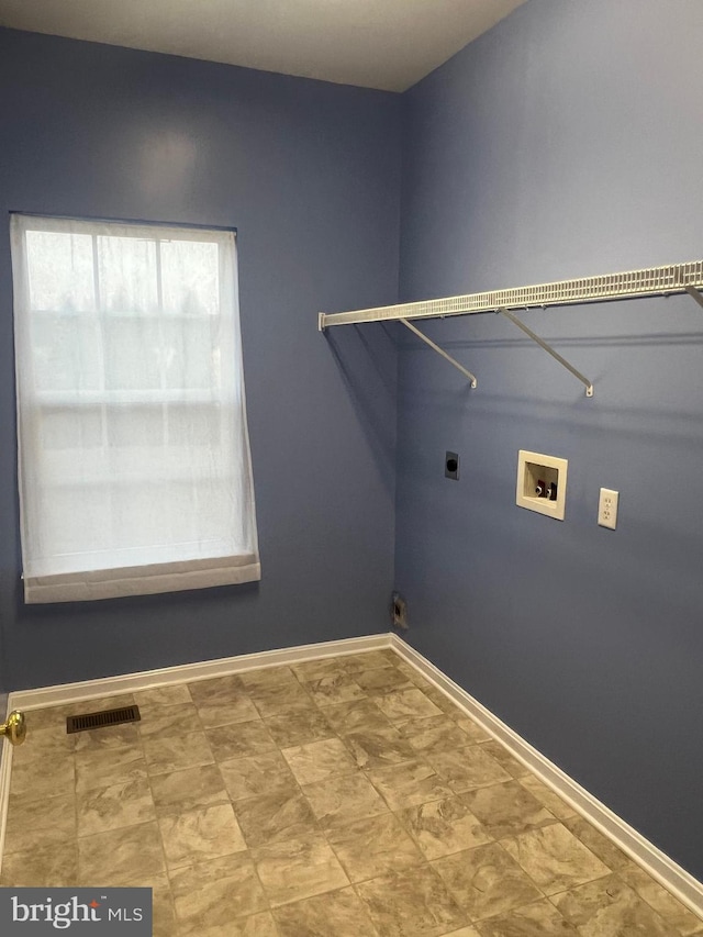 laundry room with hookup for a washing machine, baseboards, visible vents, hookup for an electric dryer, and laundry area