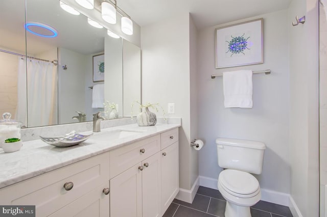 bathroom with a shower with shower curtain, toilet, vanity, tile patterned flooring, and baseboards