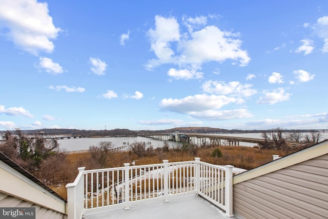 wooden terrace with a water view