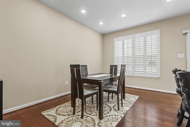 dining area featuring dark hardwood / wood-style floors