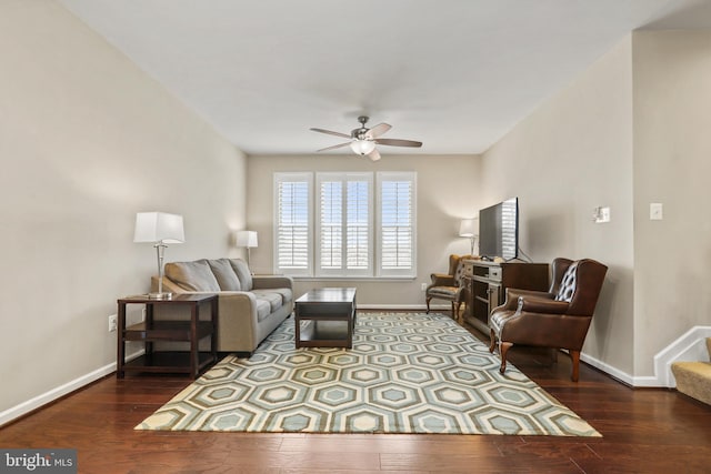 living room with hardwood / wood-style flooring and ceiling fan