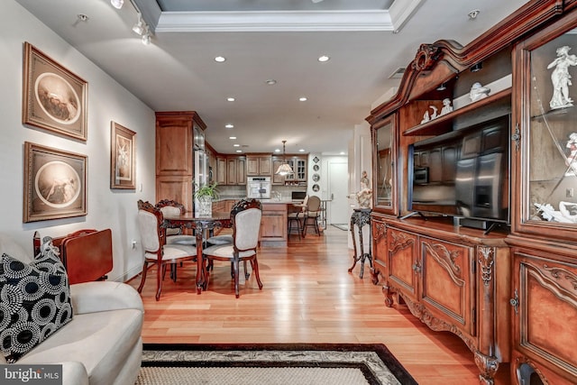 living room with visible vents, recessed lighting, and light wood finished floors