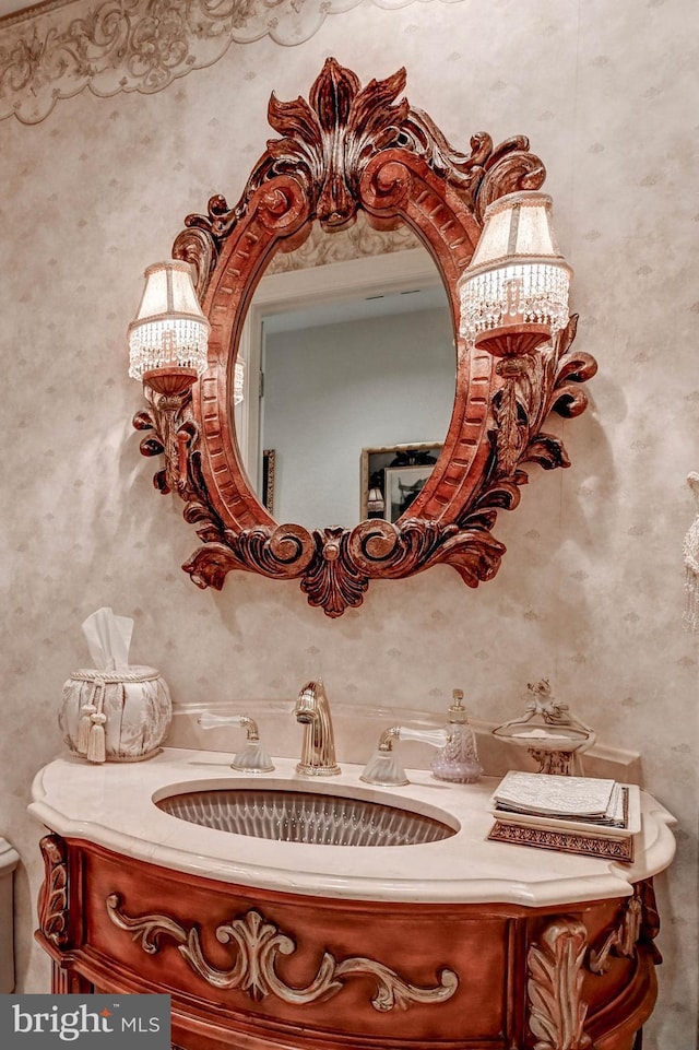 bathroom with vanity and a notable chandelier