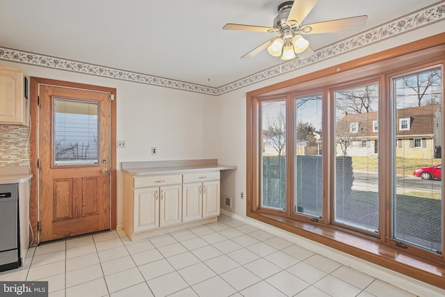 unfurnished dining area featuring visible vents, light tile patterned floors, and a wealth of natural light