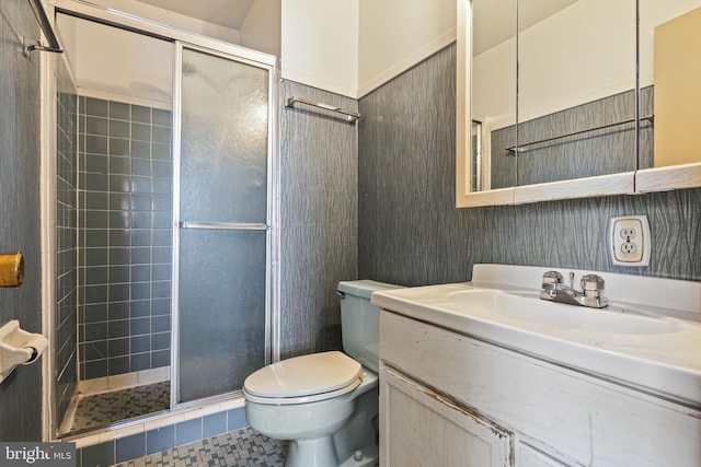 full bathroom with vanity, tile patterned flooring, a shower stall, and toilet