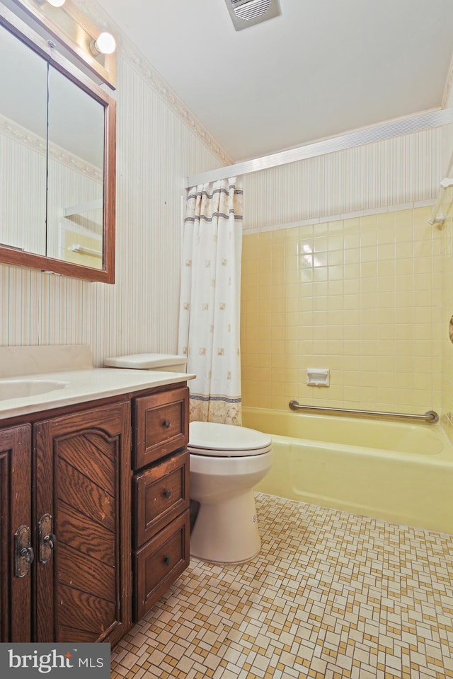 bathroom with toilet, visible vents, vanity, shower / bath combo, and wallpapered walls