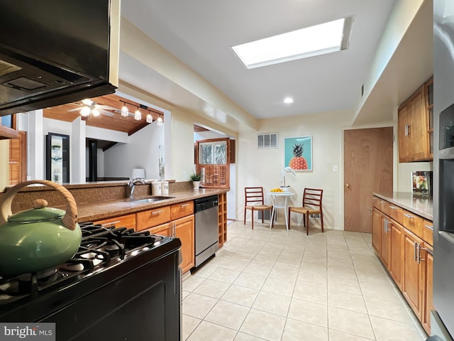 kitchen featuring visible vents, brown cabinets, stainless steel dishwasher, a sink, and light tile patterned flooring