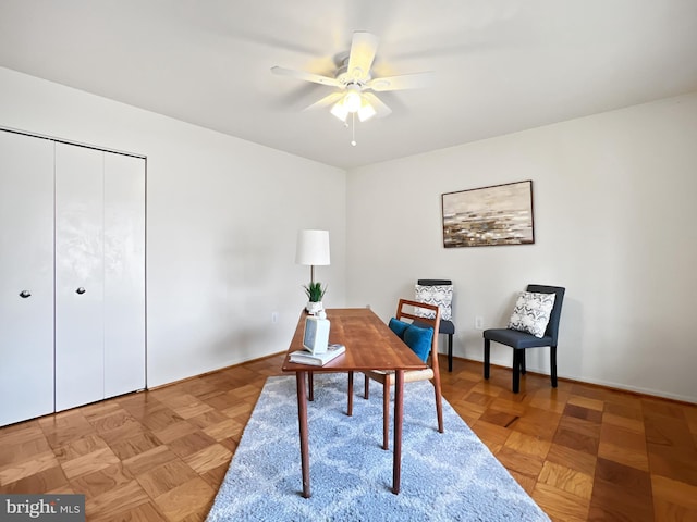 office space featuring ceiling fan