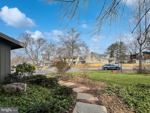 view of yard with a residential view