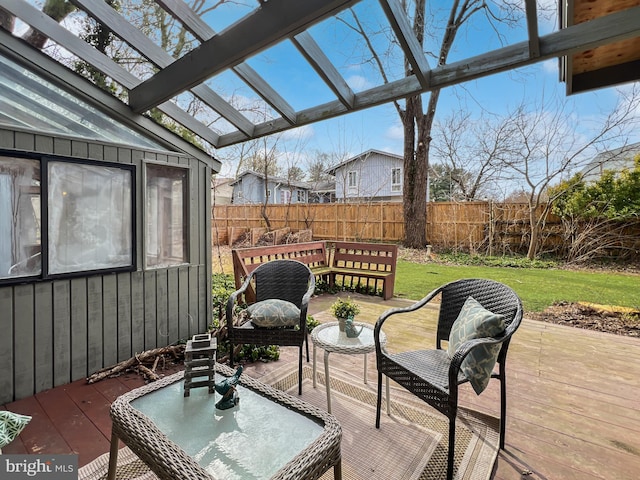 wooden deck with a fenced backyard, a lawn, and a pergola