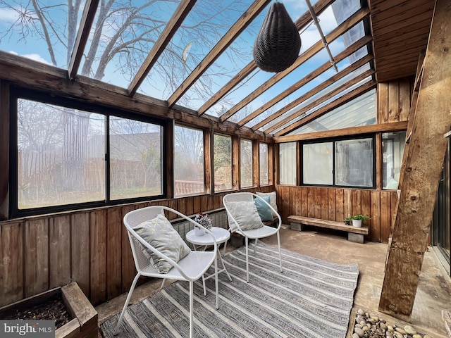 sunroom with lofted ceiling with skylight