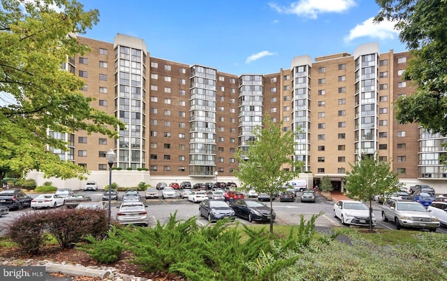 view of property with uncovered parking