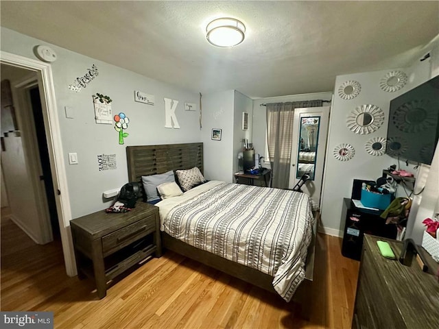 bedroom featuring hardwood / wood-style floors