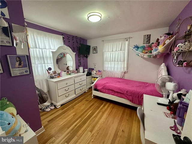 bedroom with light hardwood / wood-style flooring