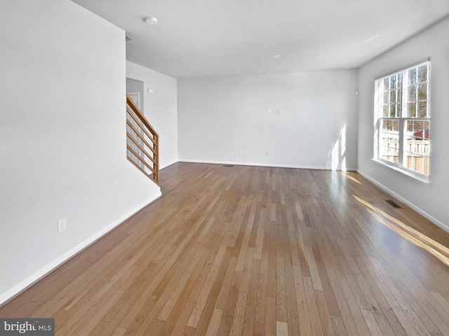 unfurnished living room with light wood-type flooring