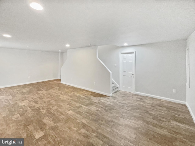 basement featuring hardwood / wood-style flooring