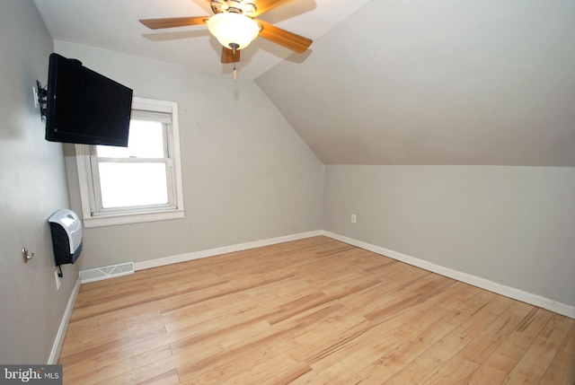 bonus room with light wood-style floors, baseboards, and visible vents