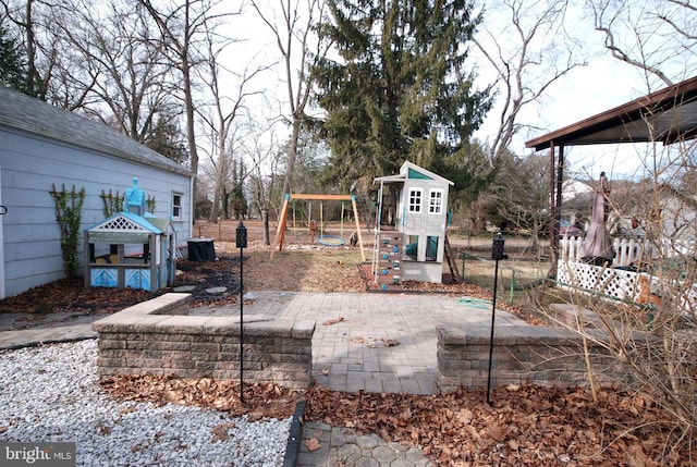 view of yard with a playground and fence