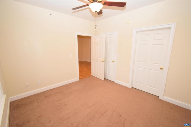 unfurnished bedroom with ceiling fan and carpet flooring