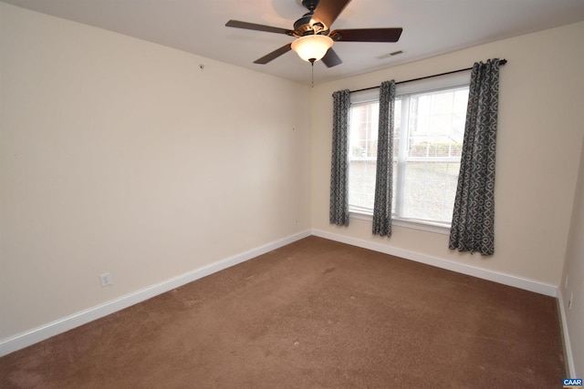 carpeted empty room featuring ceiling fan