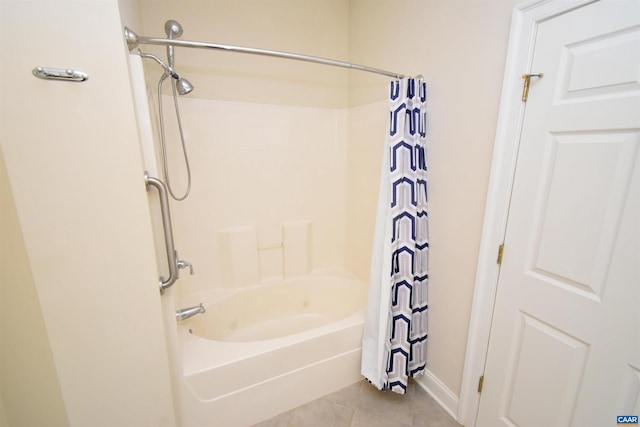 bathroom featuring tile patterned flooring and shower / bath combo with shower curtain