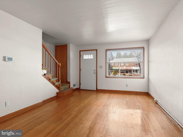 foyer entrance with light hardwood / wood-style flooring