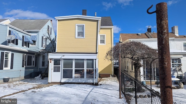 view of snow covered house