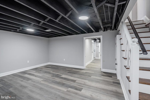 basement featuring wood-type flooring